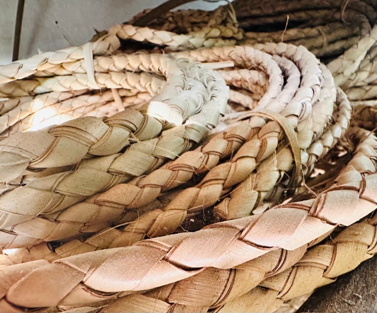Coiled braided palm and rattan cord in natural tones, raw materials for the lantern